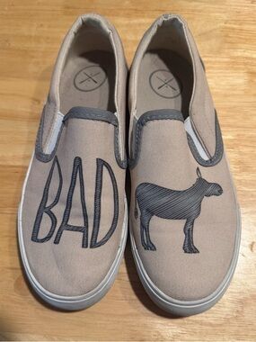 inkkas Beige Canvas Slip-On Sneakers with Black 'BAD' & Cow Print